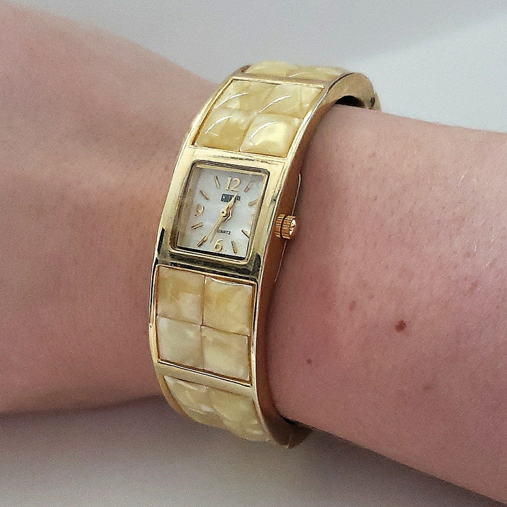 Gold square face watch
